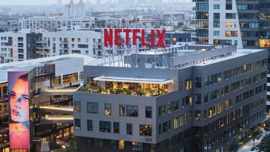 Netflix y Warner Bros en una ilustración editorial que refleja la magnitud de su acuerdo estratégico en el mercado del streaming